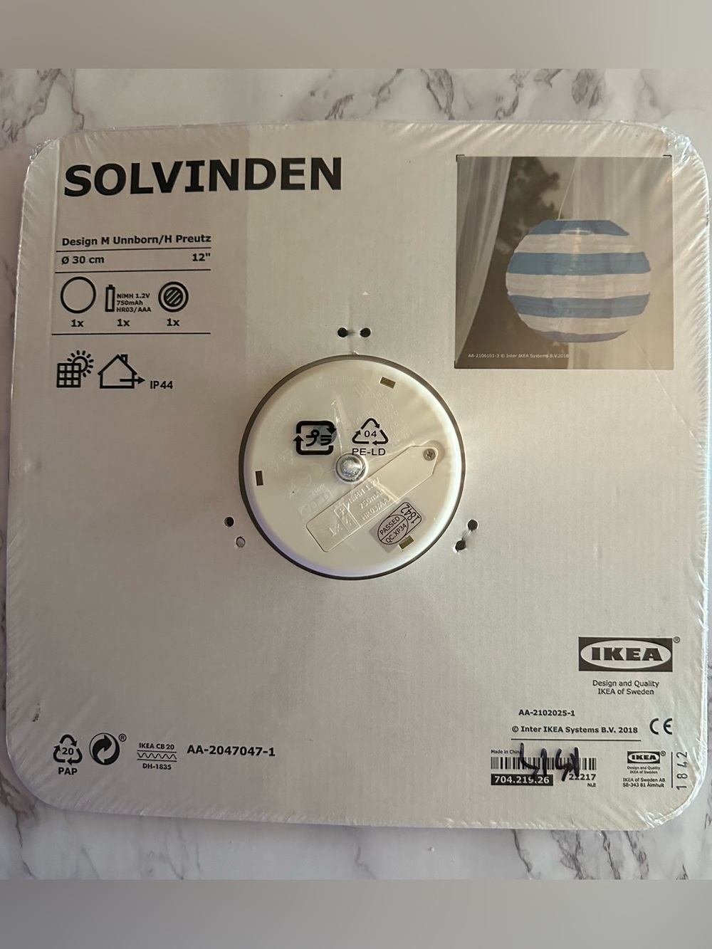Blue and white IKEA Solvinden Lantern